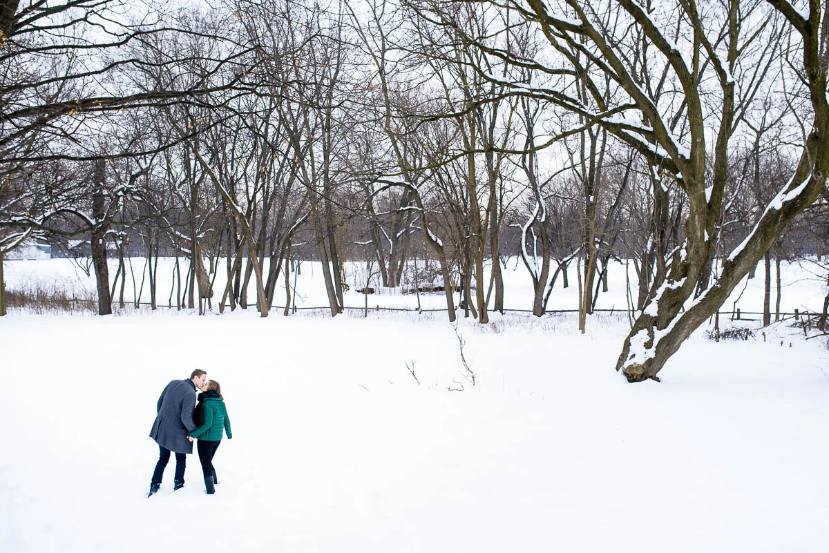 Lawrence & Katie joy embrace during their Chicago winter engagement session at Billy Caldwell Golf Course. 