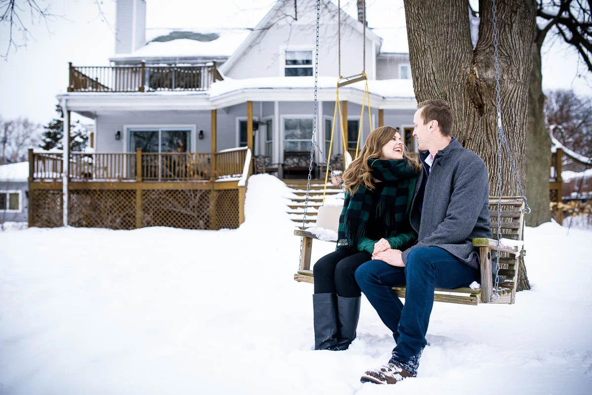 Lawrence & Katie joy embrace during their Chicago winter engagement session at Billy Caldwell Golf Course.