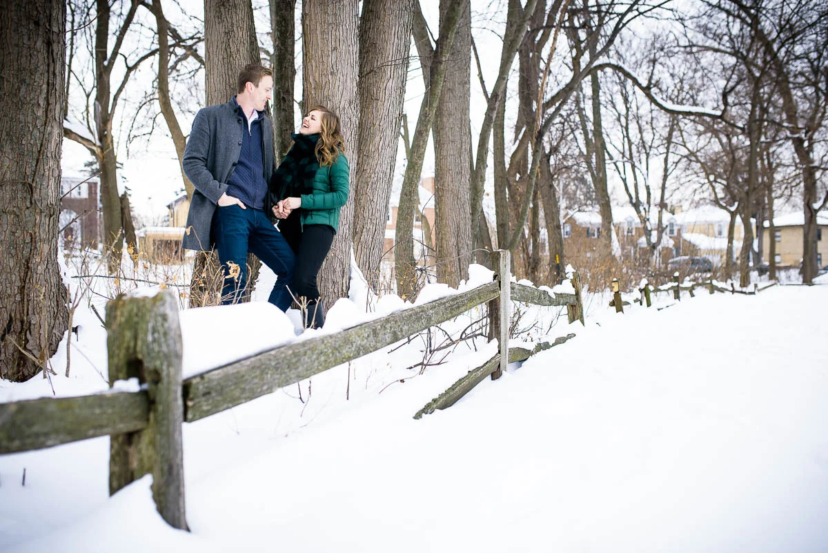 Lawrence & Katie joy embrace during their Chicago winter engagement session at Billy Caldwell Golf Course.