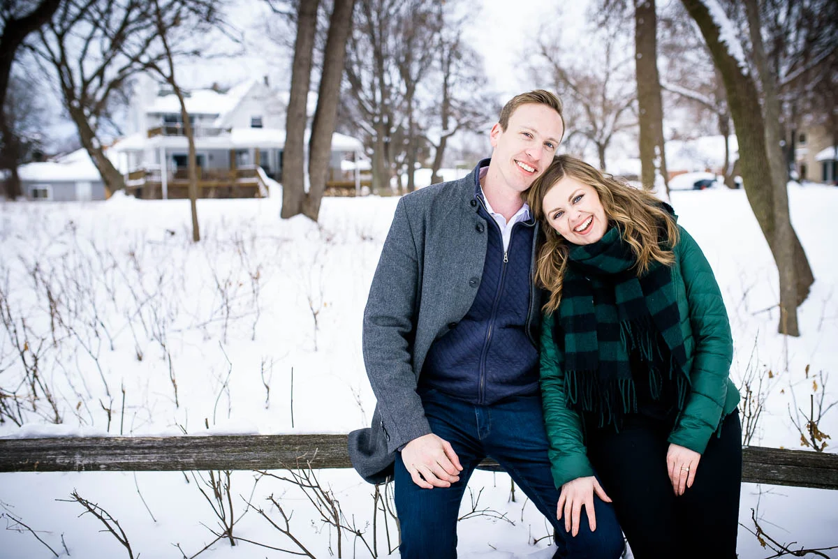 Lawrence & Katie joy embrace during their Chicago winter engagement session at Billy Caldwell Golf Course.