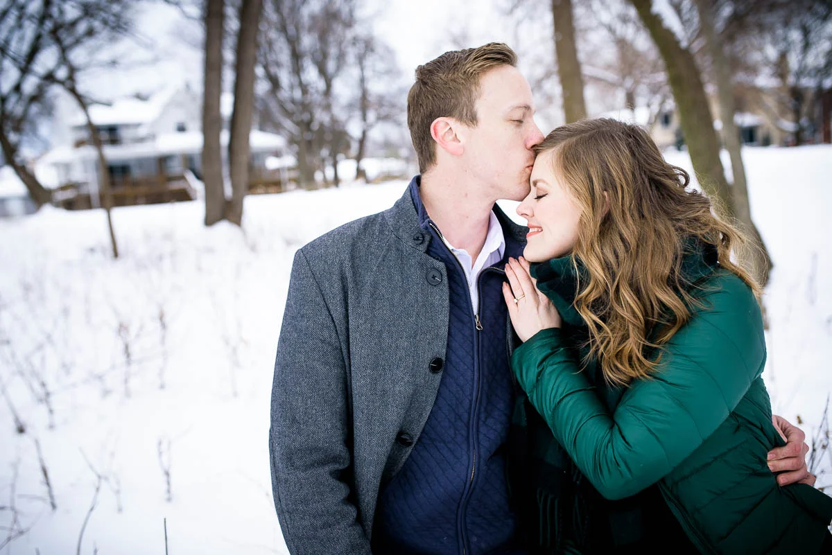 Lawrence & Katie joy embrace during their Chicago winter engagement session at Billy Caldwell Golf Course.