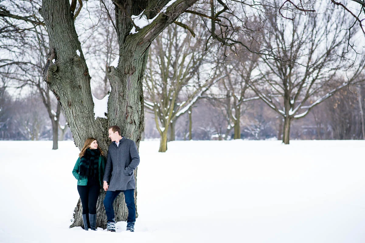 Lawrence & Katie joy embrace during their Chicago winter engagement session at Billy Caldwell Golf Course.