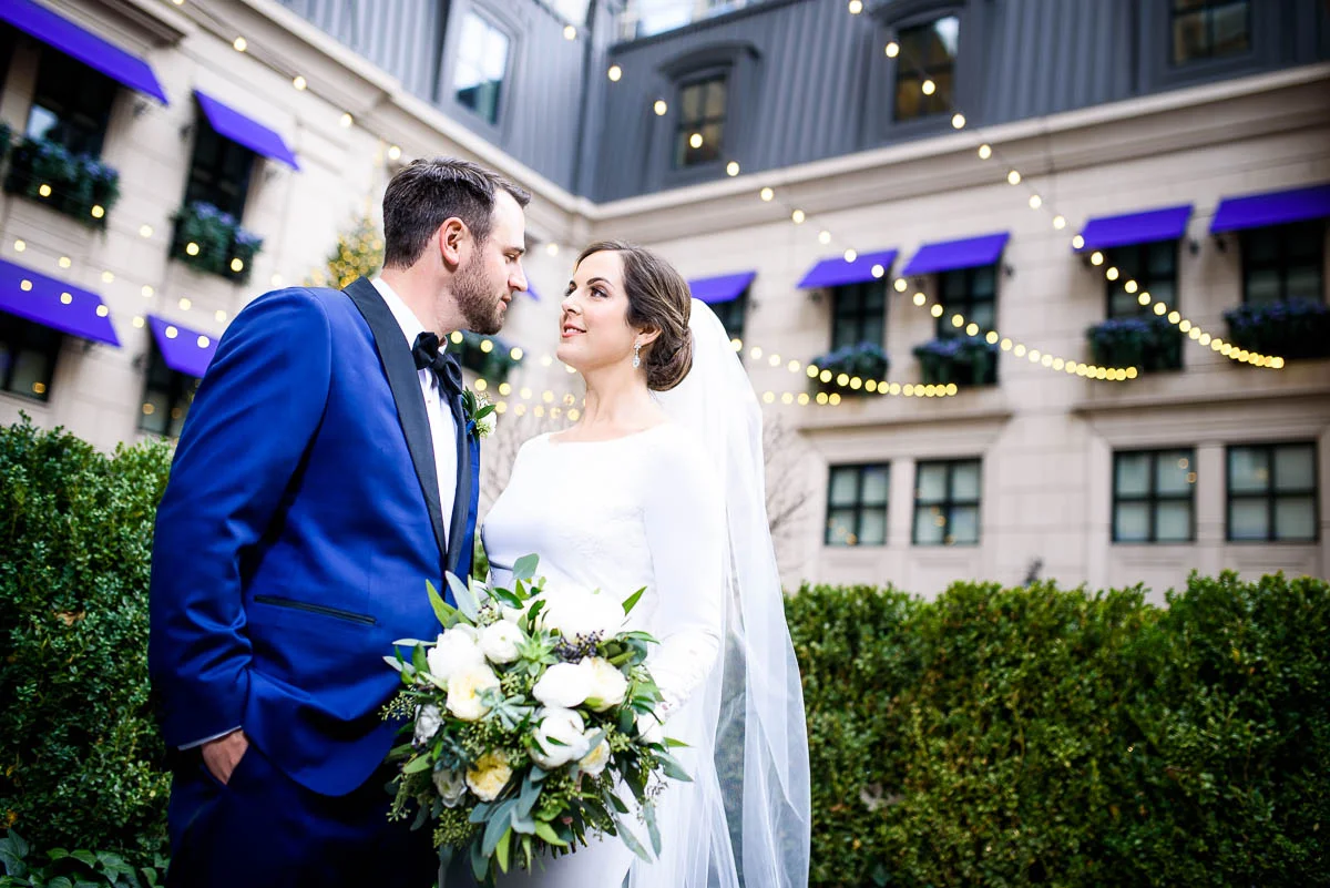 Bride & groom outside the Waldorf Astoria during their MCA Chicago winter wedding. 