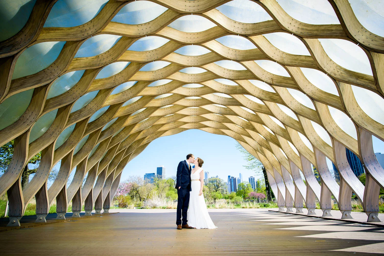 Wedding photo of bride and groom at the honeycomb sculpture in Lincoln Park Chicago.