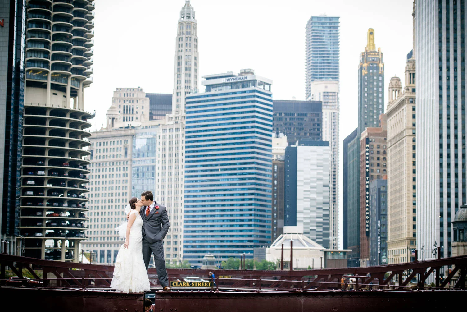 Wedding photo of bride and groom on a bridge over the Chicago river. 