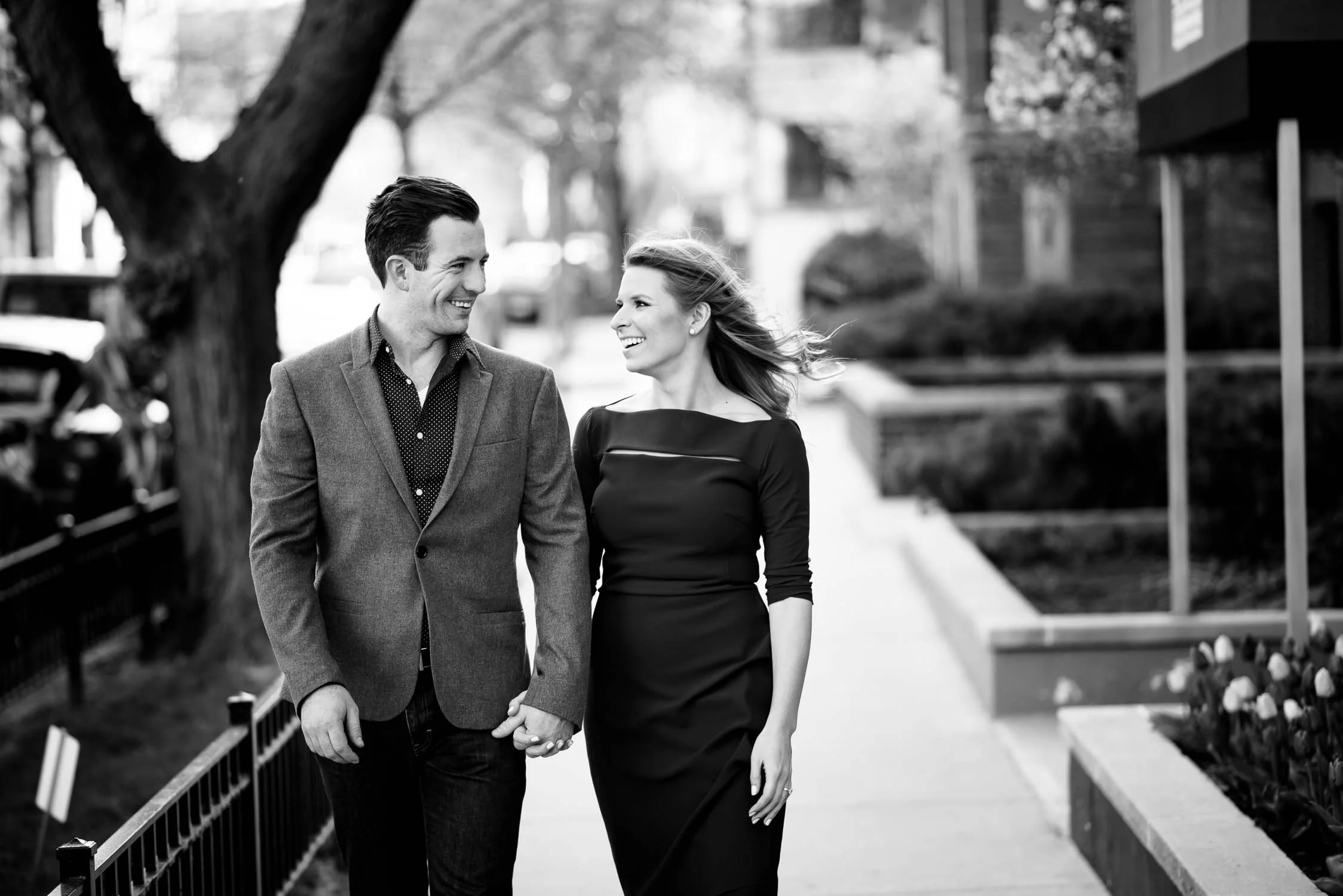 Bride and groom take a stroll outside their Lincoln Park home during their Chicago engagement session. 