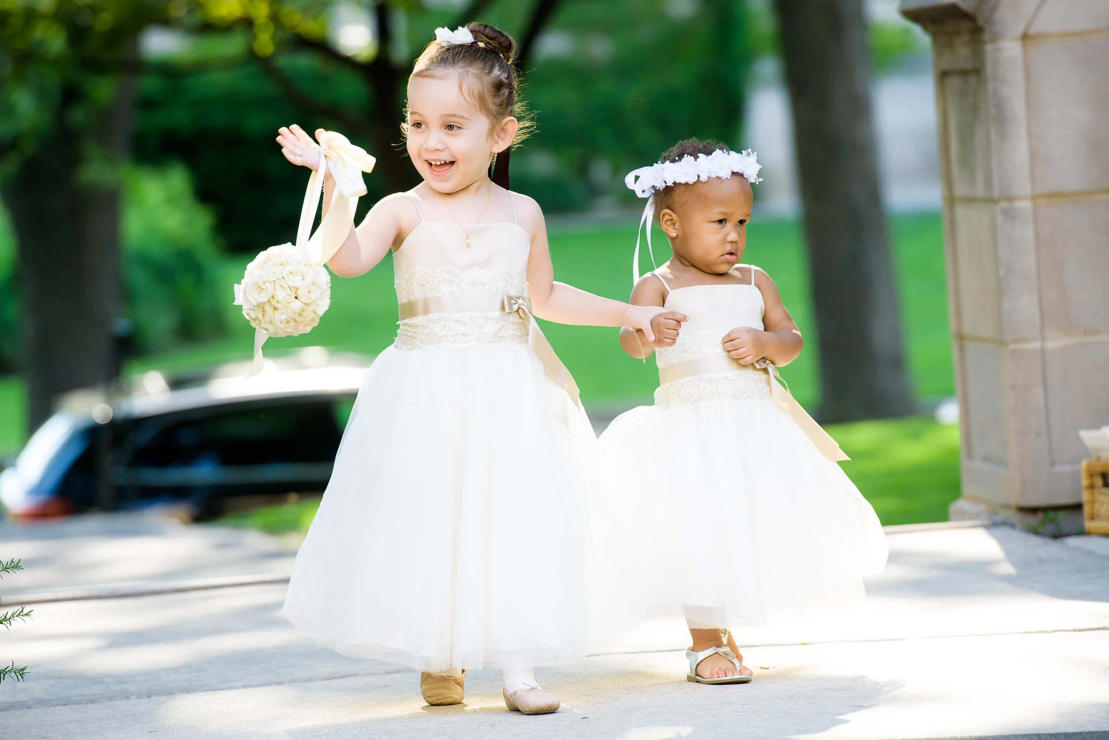 Flowers girls walk down the aisle during a University of Chicago wedding ceremony. 