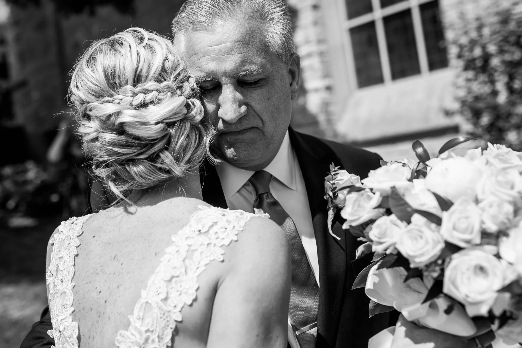 Emotional moment between father and bride before her St. Charles Country Club wedding. 