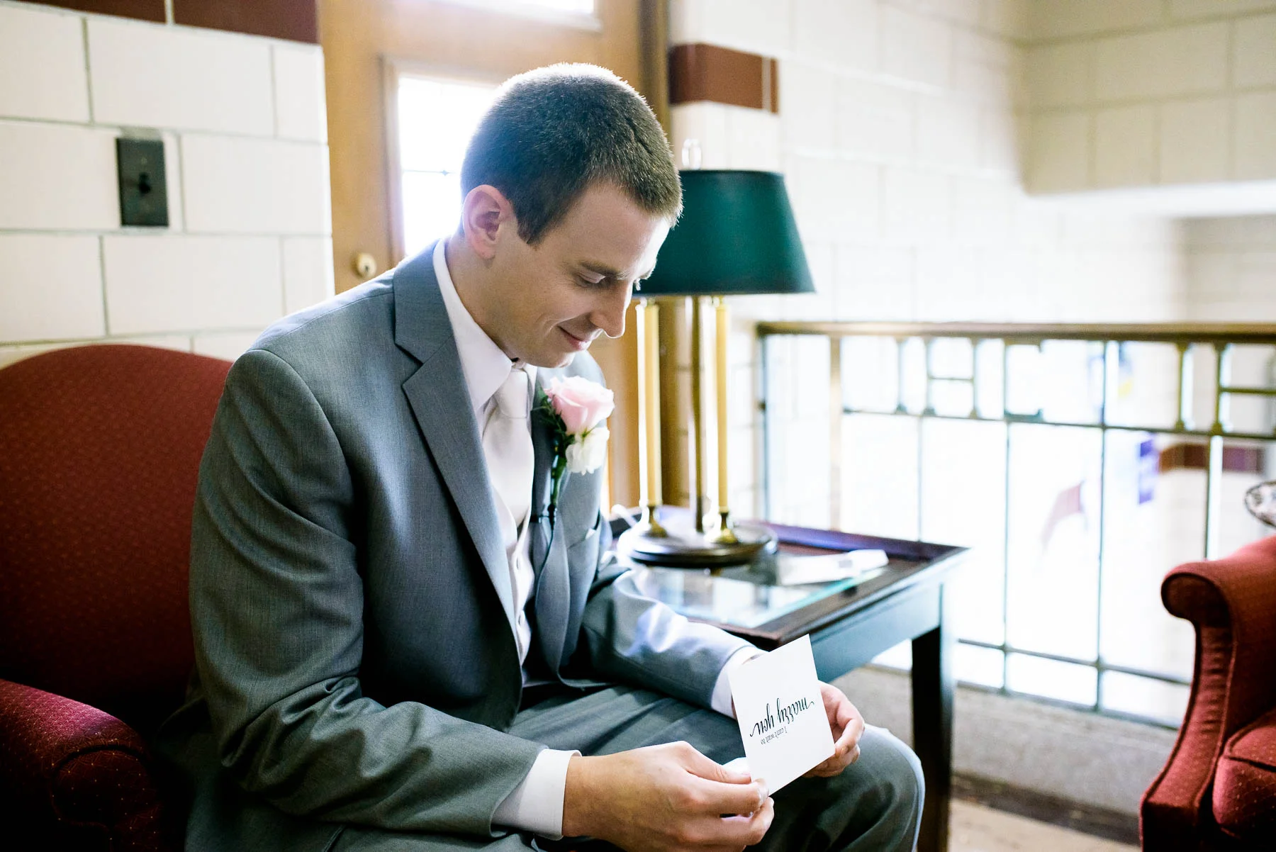 Groom reads a note from the bride before the ceremony at Baker Memorial United Methodist Church in St. Charles.