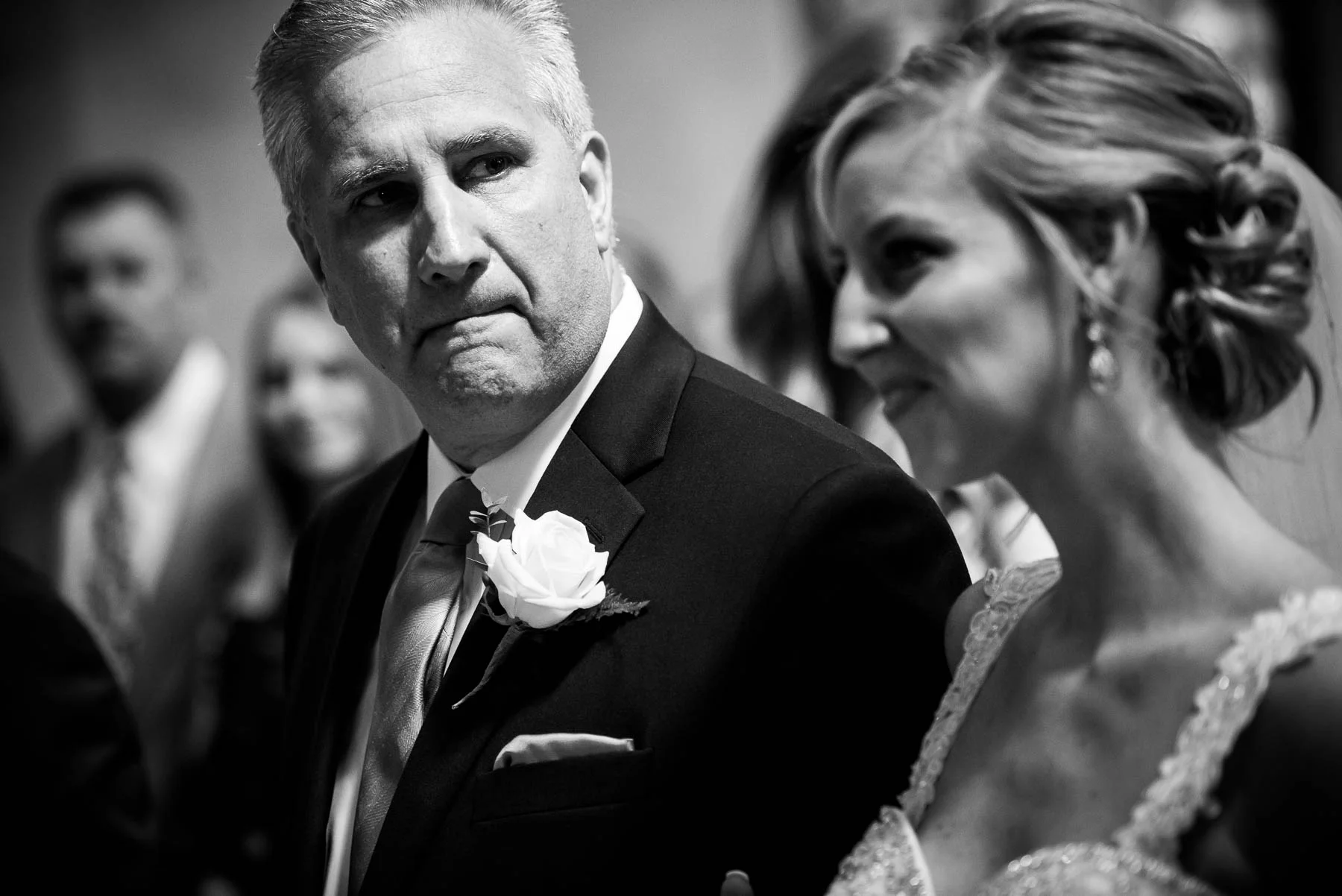 Father gets emotional during his daughter's wedding ceremony at Baker Memorial United Methodist Church in St. Charles