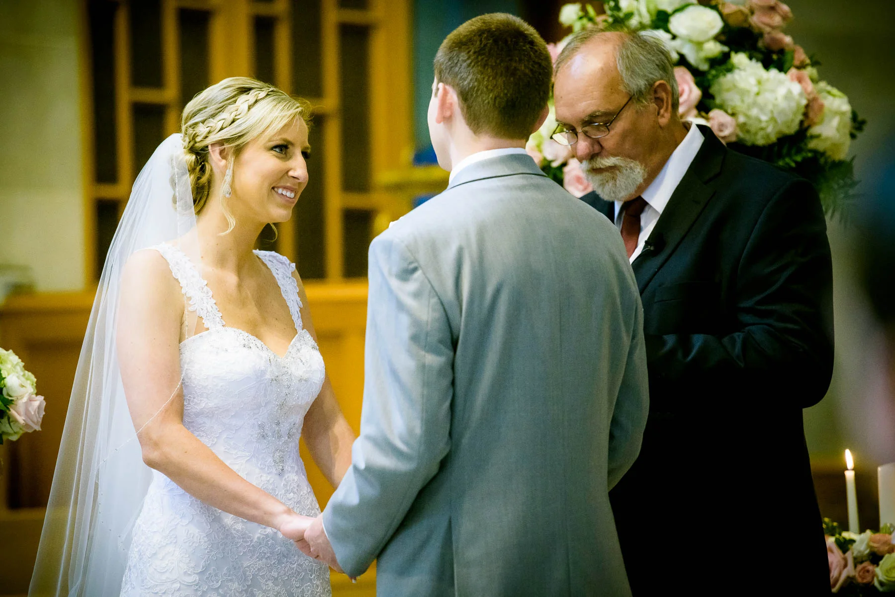 Bride and groom during their wedidng ceremony at Baker Memorial United Methodist Church in St. Charles