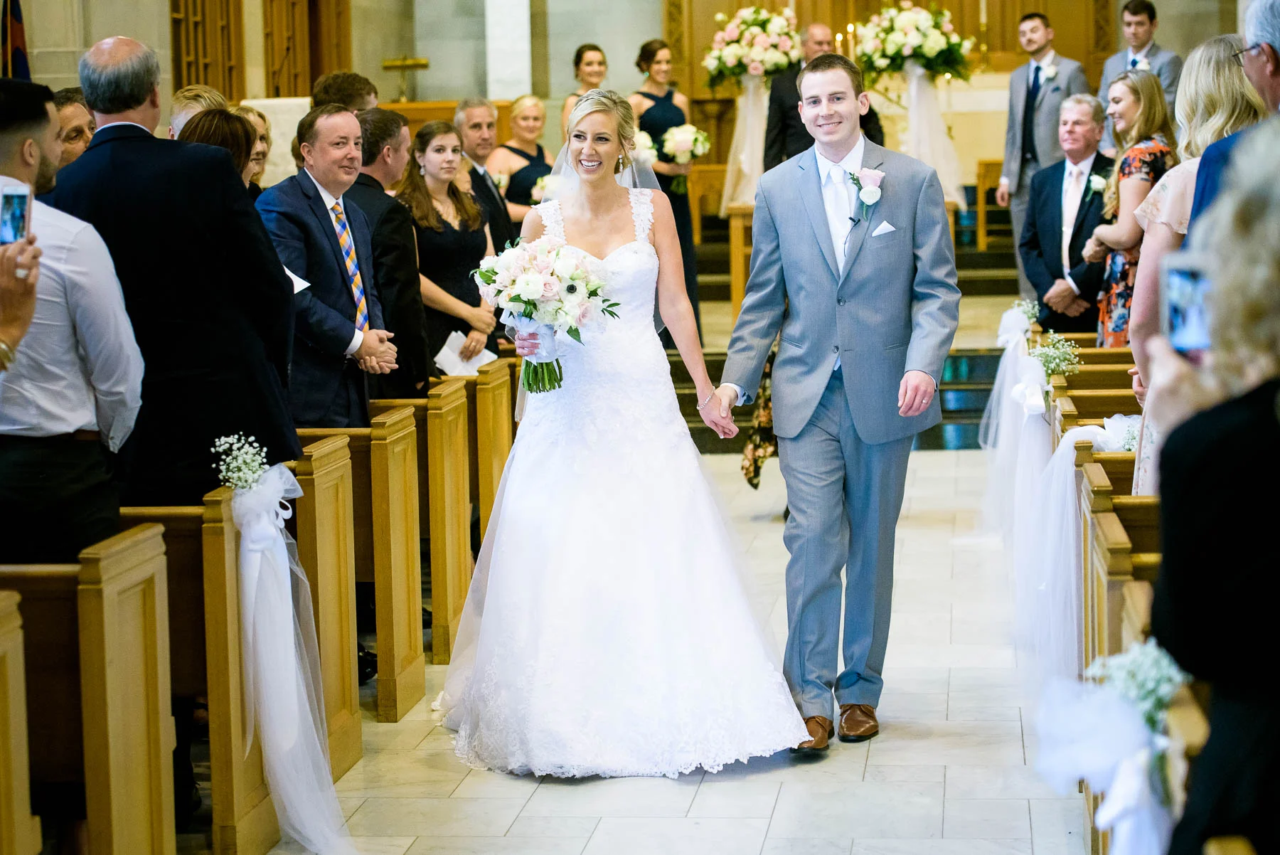 Bride and groom walk down the aisle at Baker Memorial United Methodist Church in St. Charles