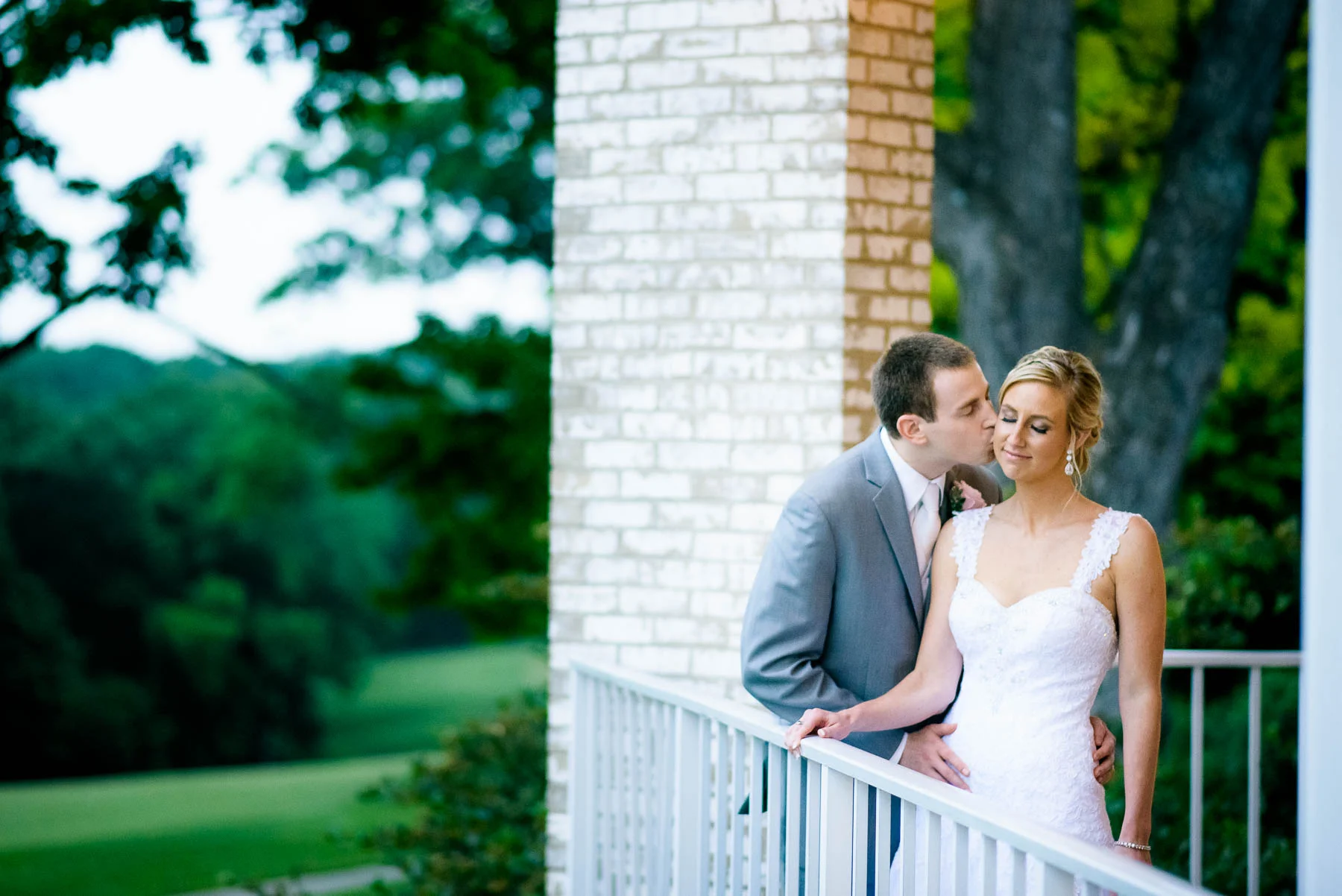 Portrait at dusk of the bride and groom during their St. Charles Country Club wedding. 