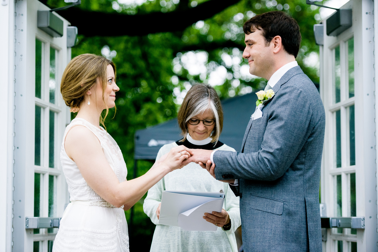 Ring exchange during a Cheney Mansion wedding in Oak Park.  