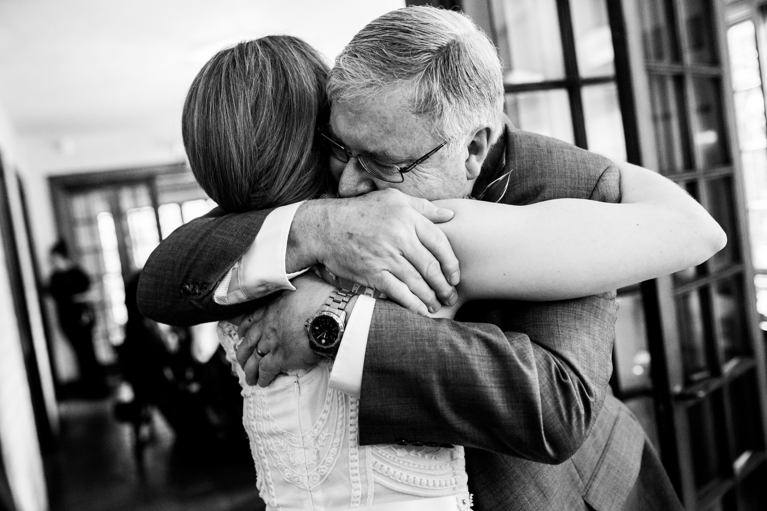 Bride and father hug after his speech during a Cheney Mansion wedding in Oak Park. 