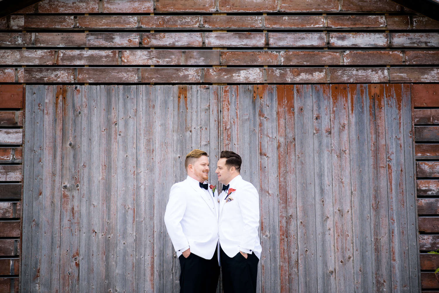 Portrait of the couple during a same sex wedding at Heritage Prairie Farm. 