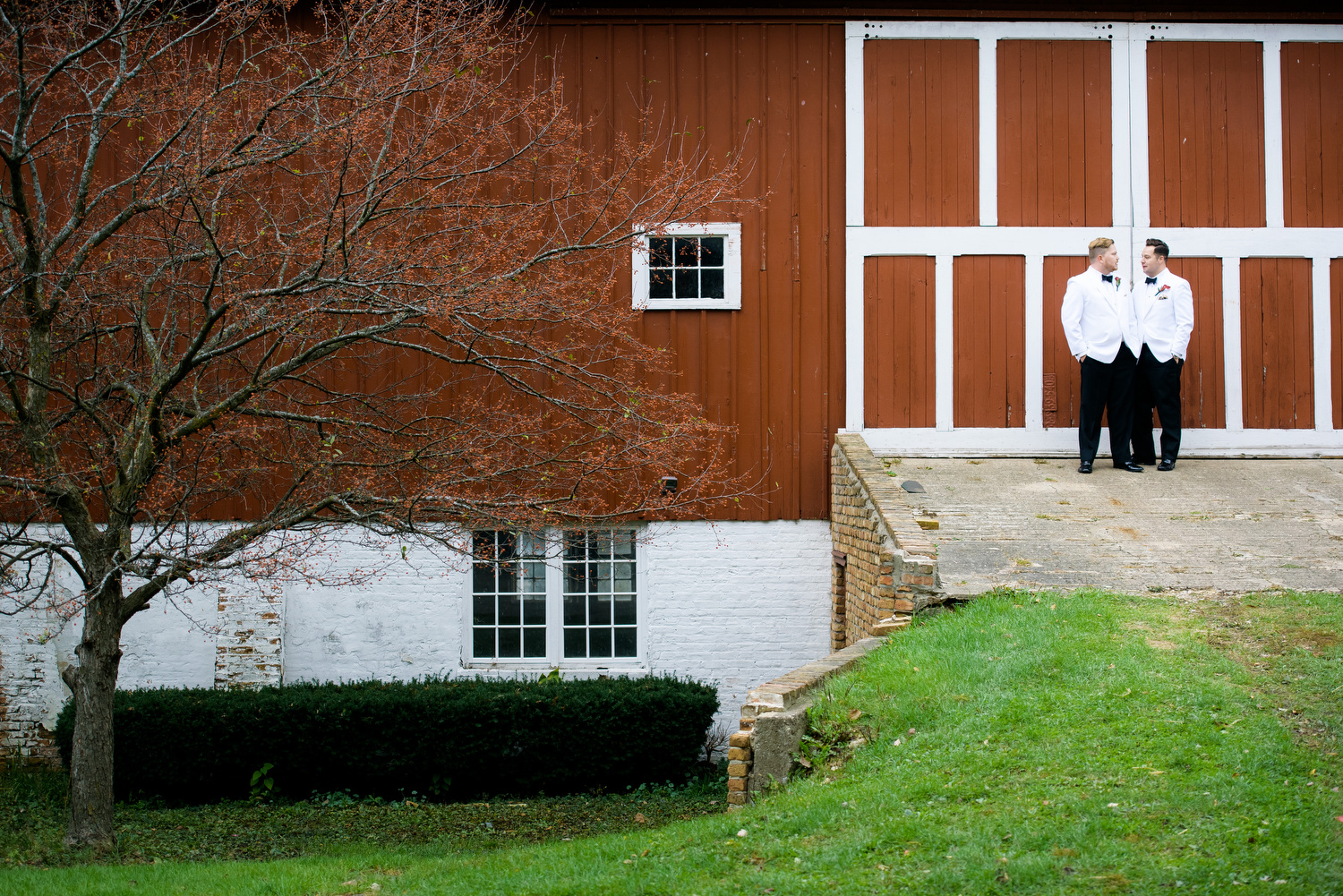 Creative wedding day portrait of the grooms at Heritage Prairie Farm. 