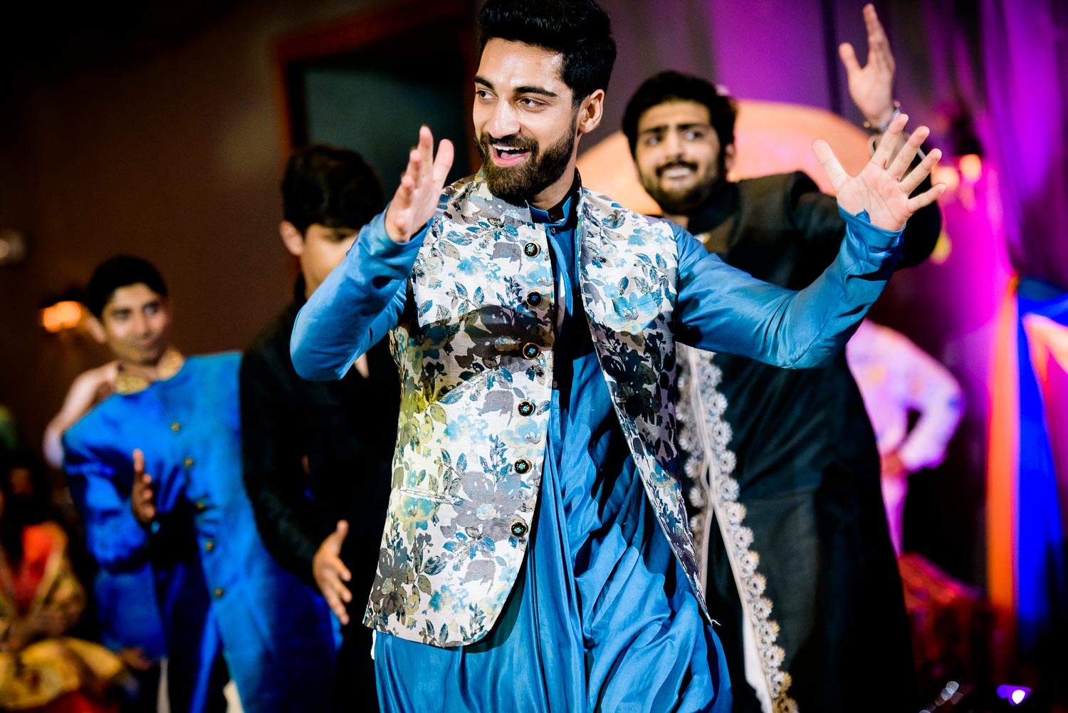 Brother of the bride dances during an Indian wedding sangeet at Stonegate Banquets in Hoffman Estates. 