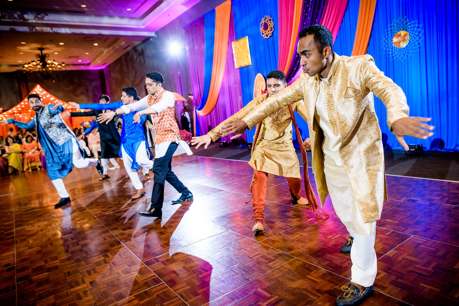 Groomsmen dance during an Indian wedding sangeet at Stonegate Banquets in Hoffman Estates. 
