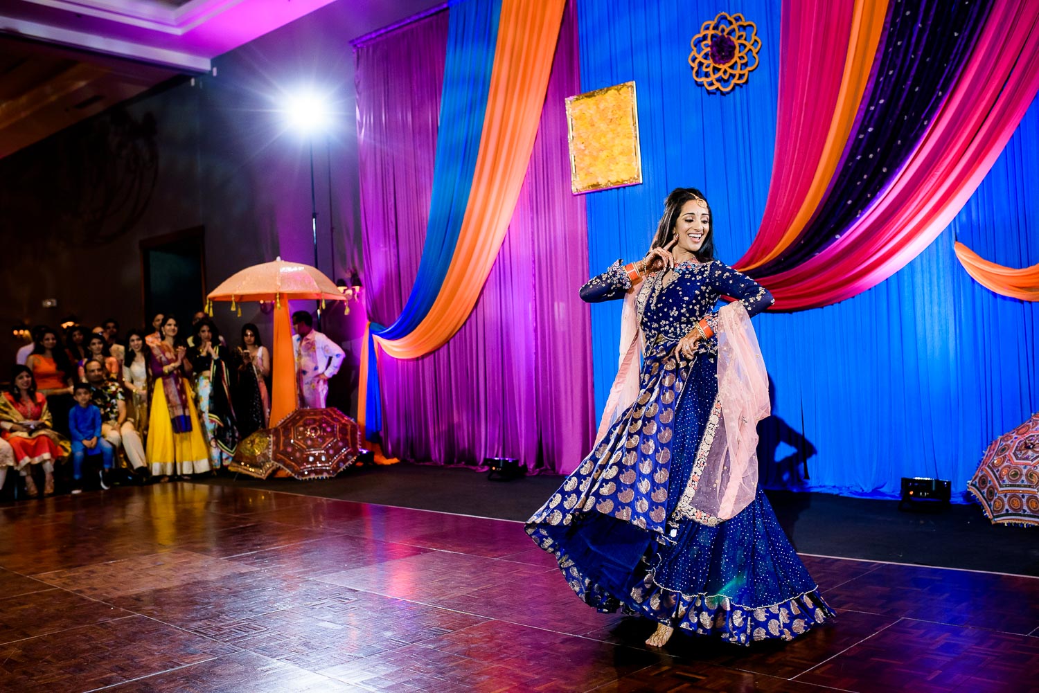 The bride dances during an Indian wedding sangeet at Stonegate Banquets in Hoffman Estates. 