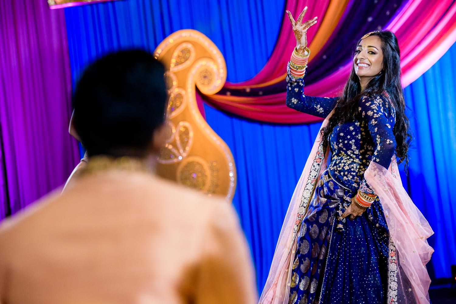 The bride dances during an Indian wedding sangeet at Stonegate Banquets in Hoffman Estates. 