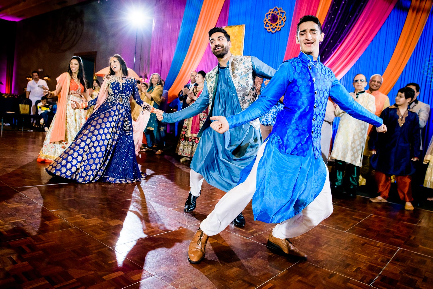 Bride and siblings dance during an Indian wedding sangeet at Stonegate Banquets in Hoffman Estates. 