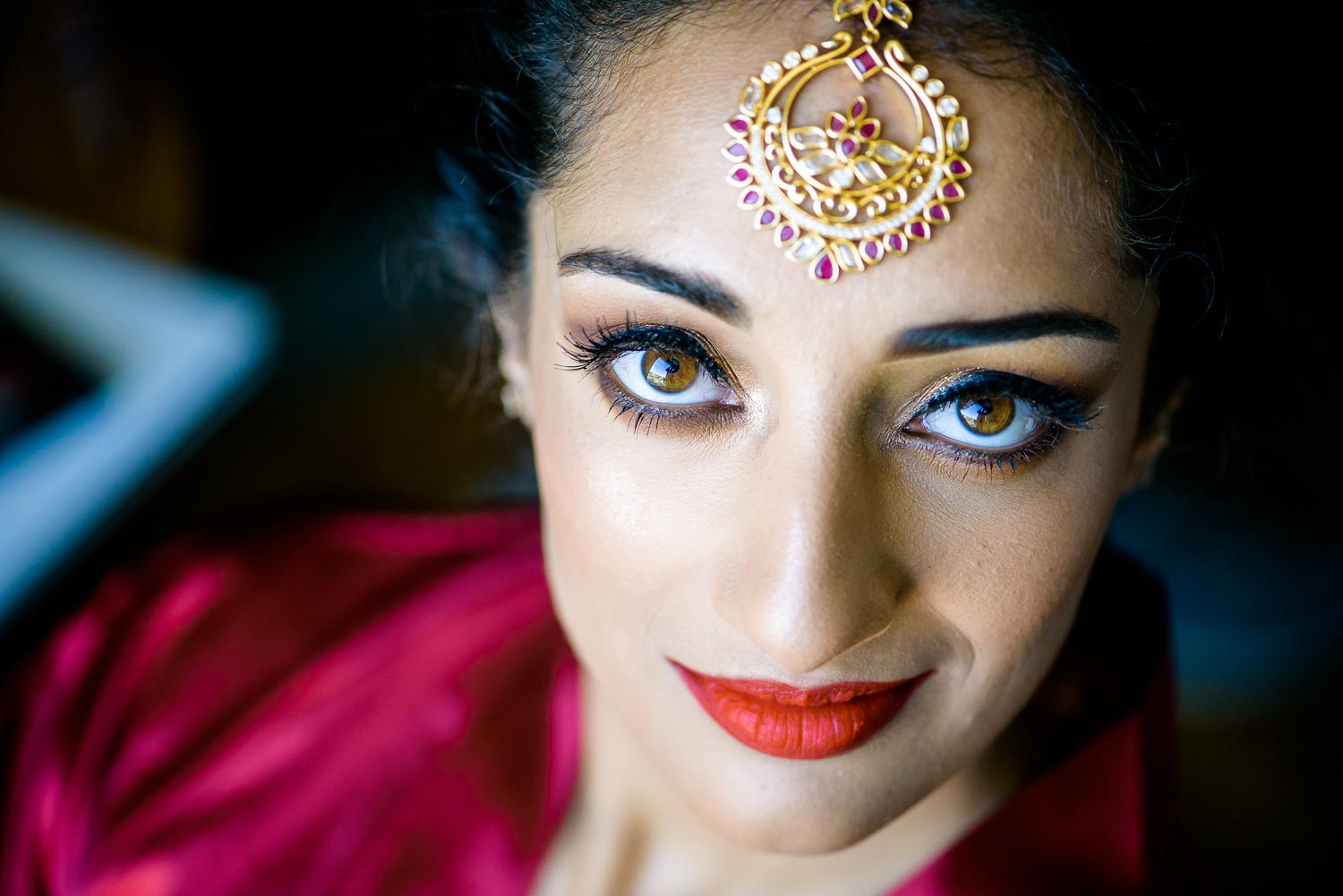 Bride getting ready during a Renaissance Schaumburg Convention Center Indian wedding.