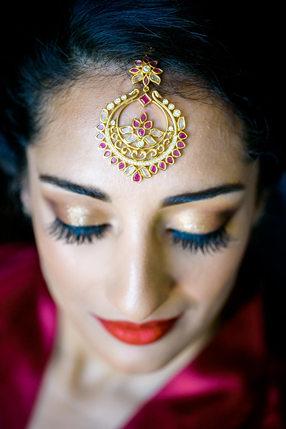 Bride getting ready during a Renaissance Schaumburg Convention Center Indian wedding.