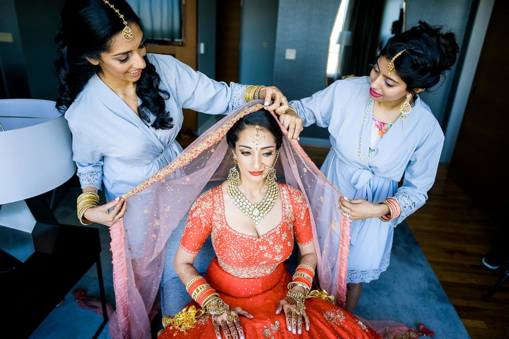 Bride getting ready before a Renaissance Schaumburg Convention Center Indian wedding.