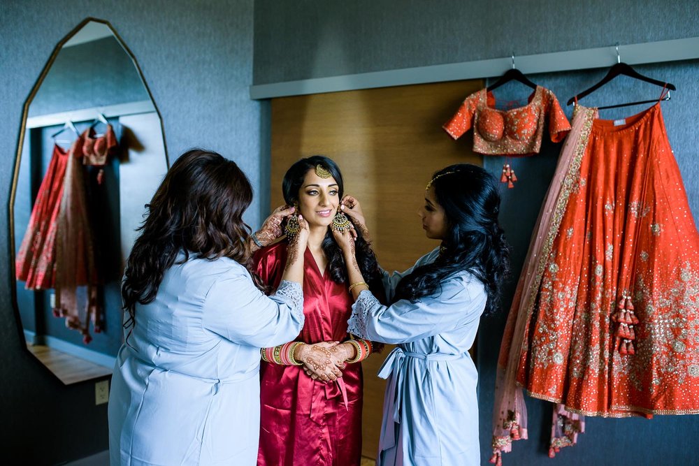 Bride getting ready during her Renaissance Schaumburg Convention Center Indian wedding.