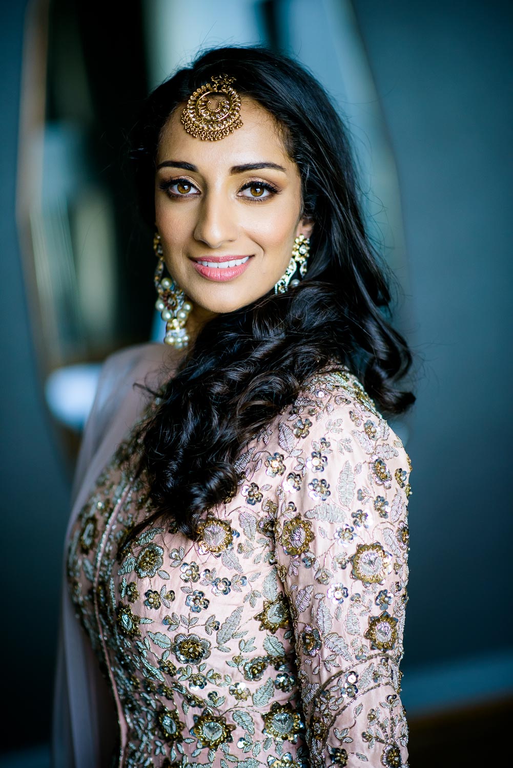 Bride getting ready during her Renaissance Schaumburg Convention Center Indian wedding.