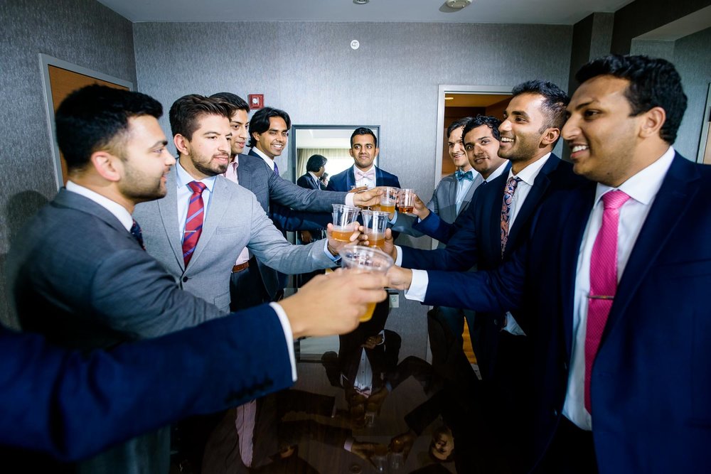 Groomsmen toast during a Renaissance Schaumburg Convention Center Indian wedding.