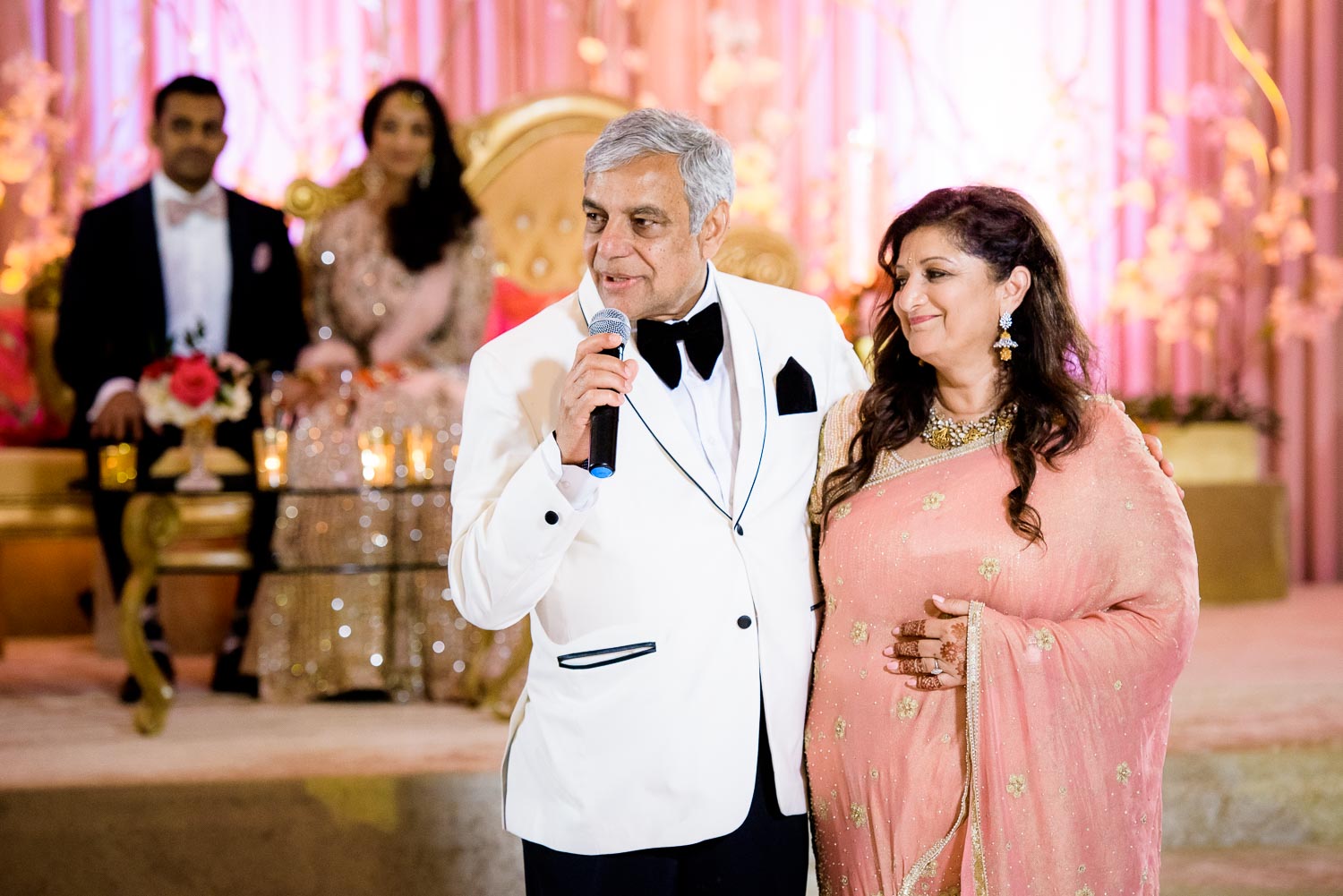Parents of the bride toast during a Renaissance Schaumburg Convention Center Indian wedding reception.