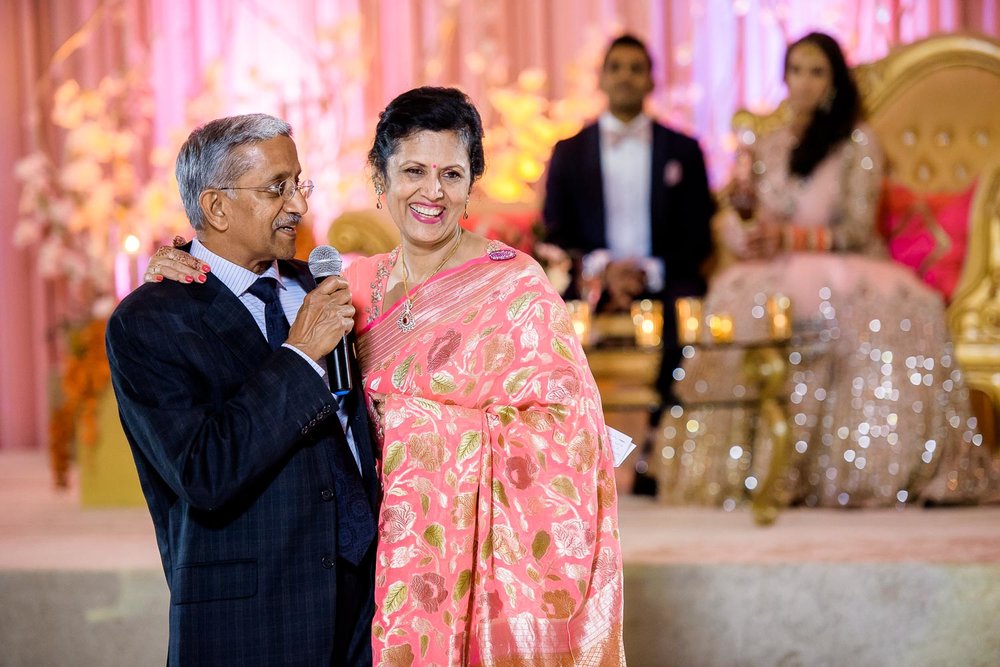 Parents of the groom toast during a Renaissance Schaumburg Convention Center Indian wedding reception.