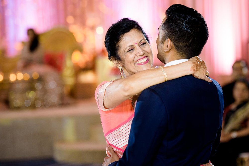 Mother son dance during a Renaissance Schaumburg Convention Center Indian wedding reception.