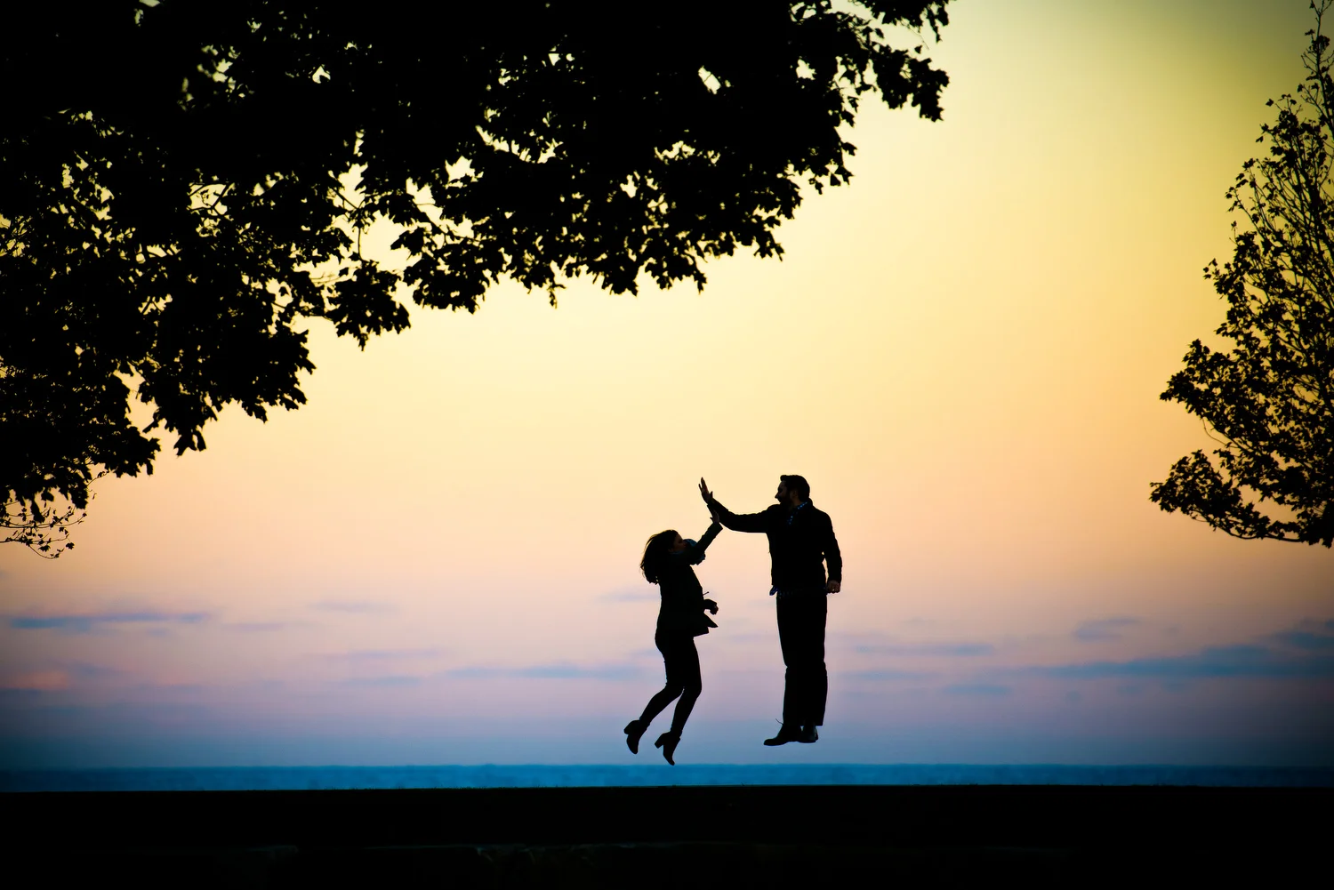 Creative sunset lakefront Chicago engagement photo.