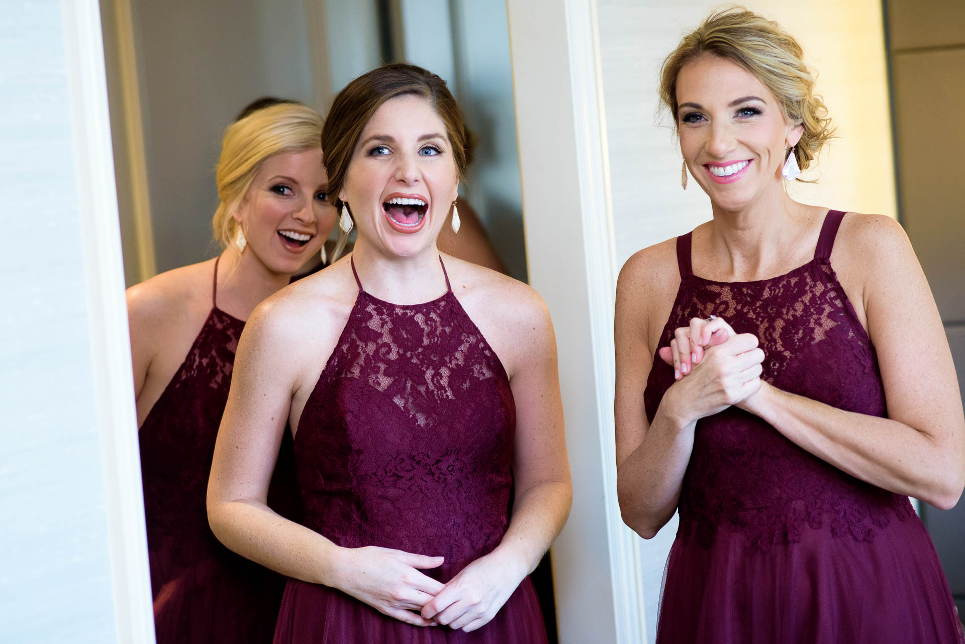 Bridesmaids react to seeing the bride during a Mid America Club wedding Chicago.