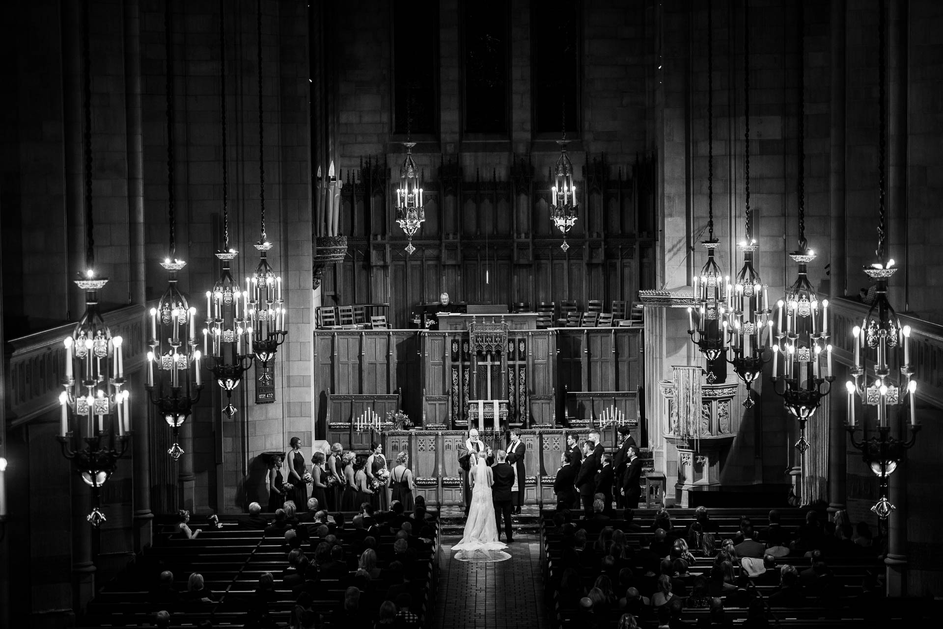 Black and white photo of a wedding ceremony at Fourth Presbyterian Church in Chicago.