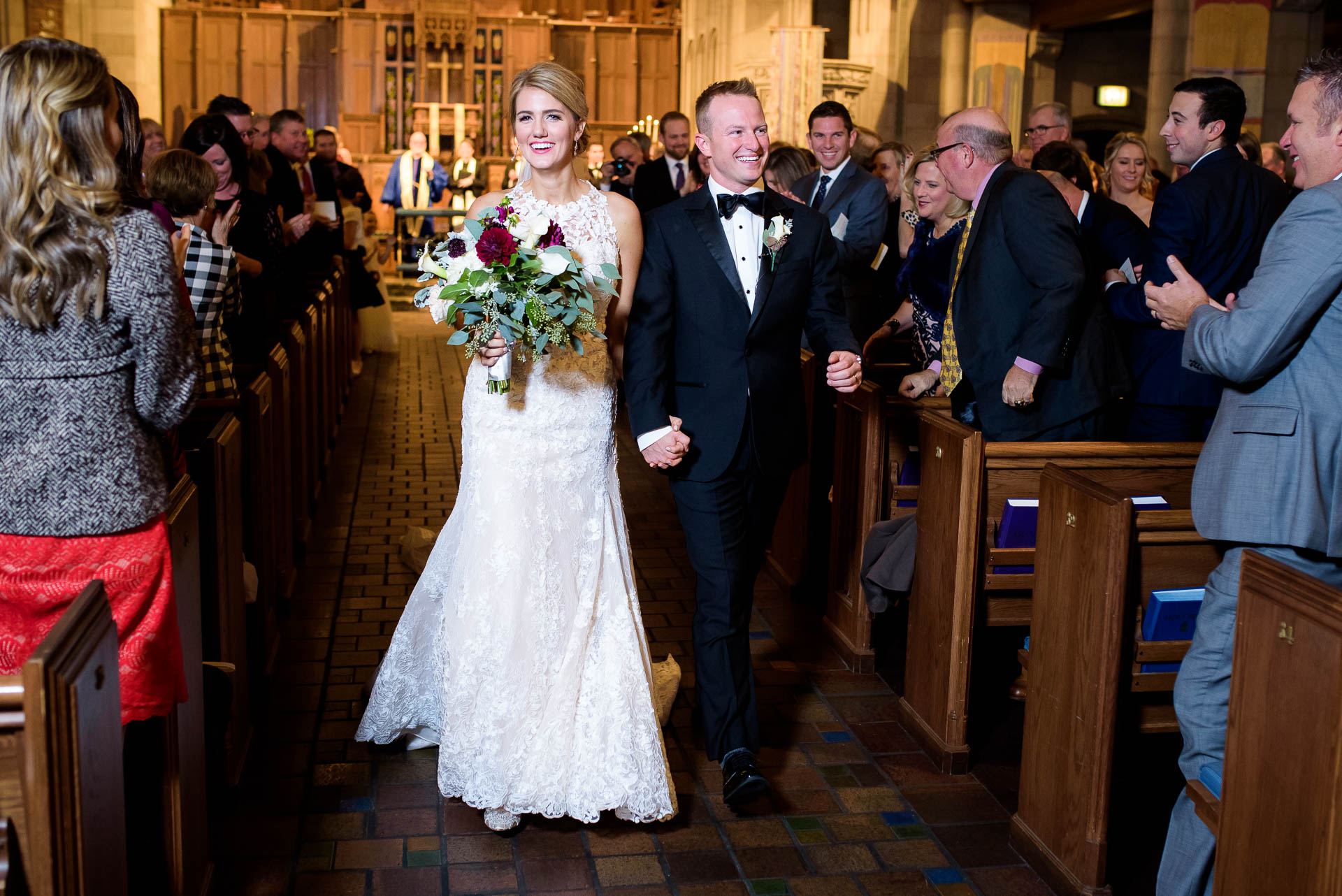 Bride and groom walk down the aisle during their wedding ceremony at Fourth Presbyterian Church in Chicago.