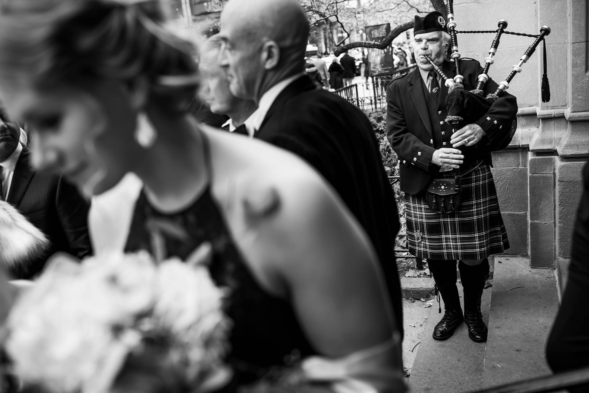 Bagpiper plays after a wedding ceremony at Fourth Presbyterian Church in Chicago.
