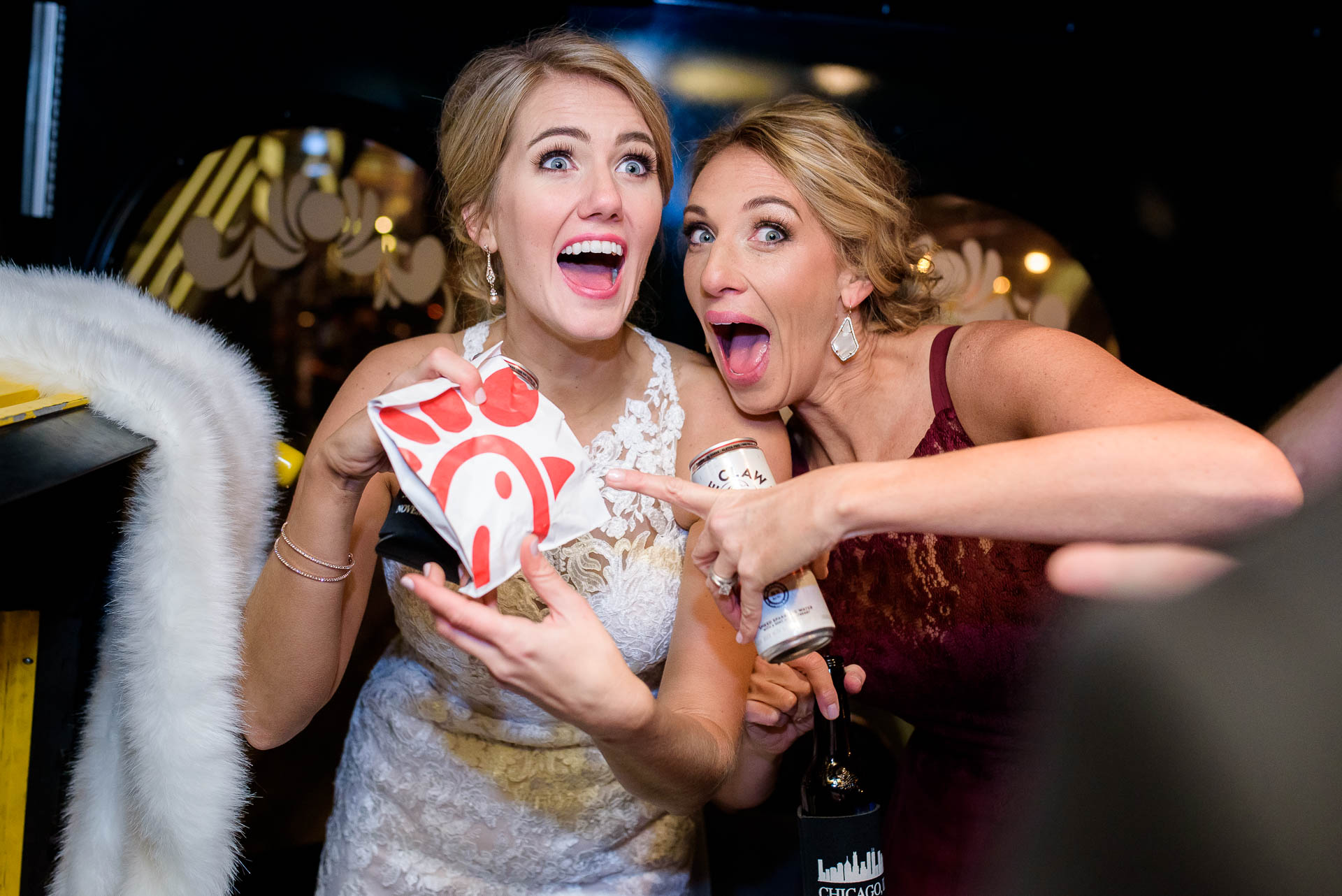 Bride and maid of honor with Chic Filet during a Mid America Club wedding in Chicago.