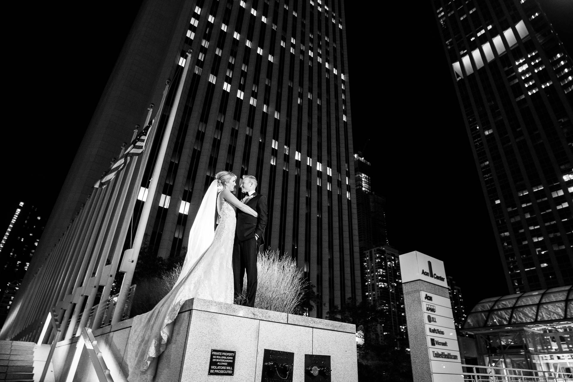 Night portrait of bride and groom outside the Mid America Club in Chicago.