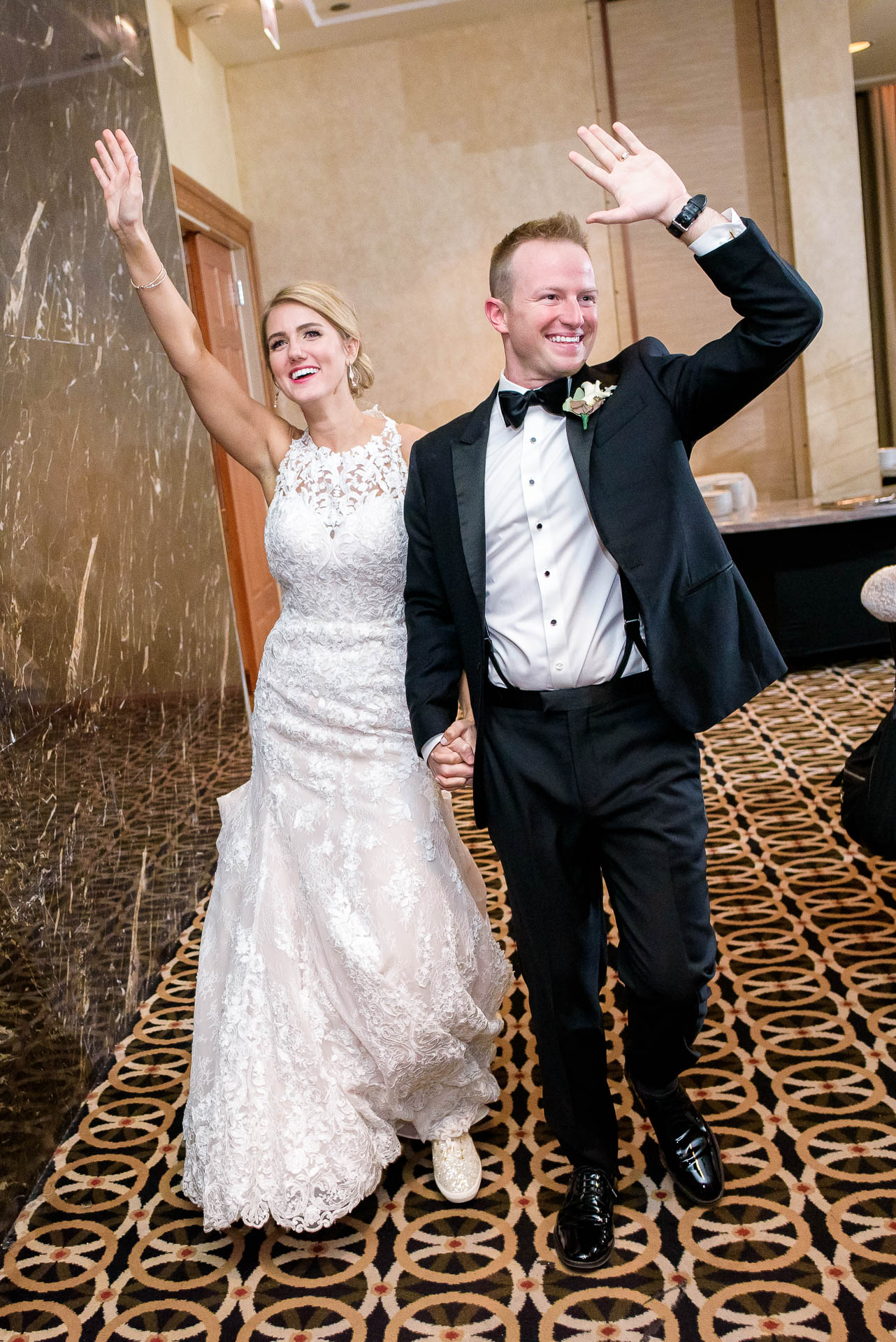 Bride and groom are introduced during their wedding reception at the Mid America Club in Chicago.