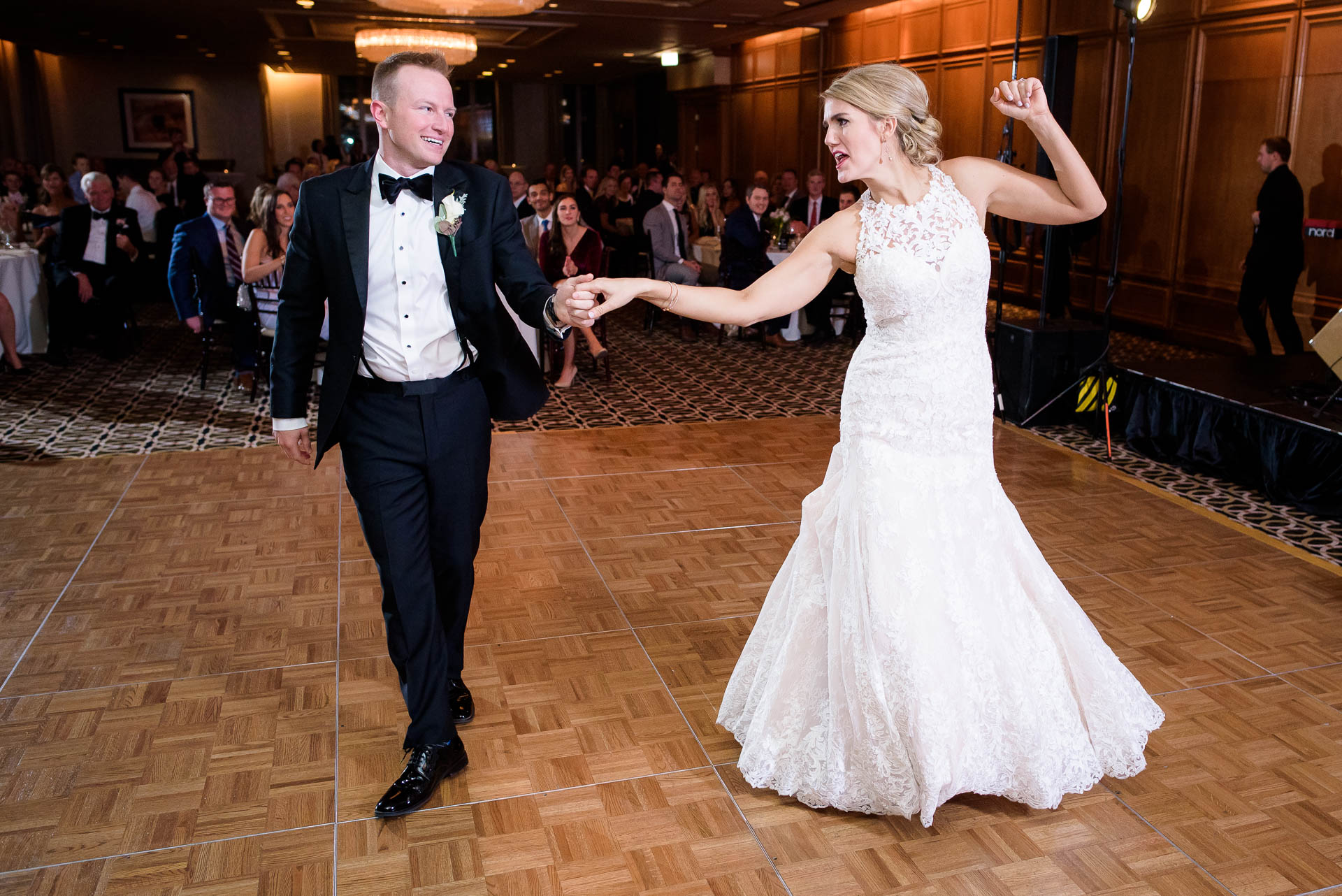 during their wedding reception at the Mid America Club in Chicago.