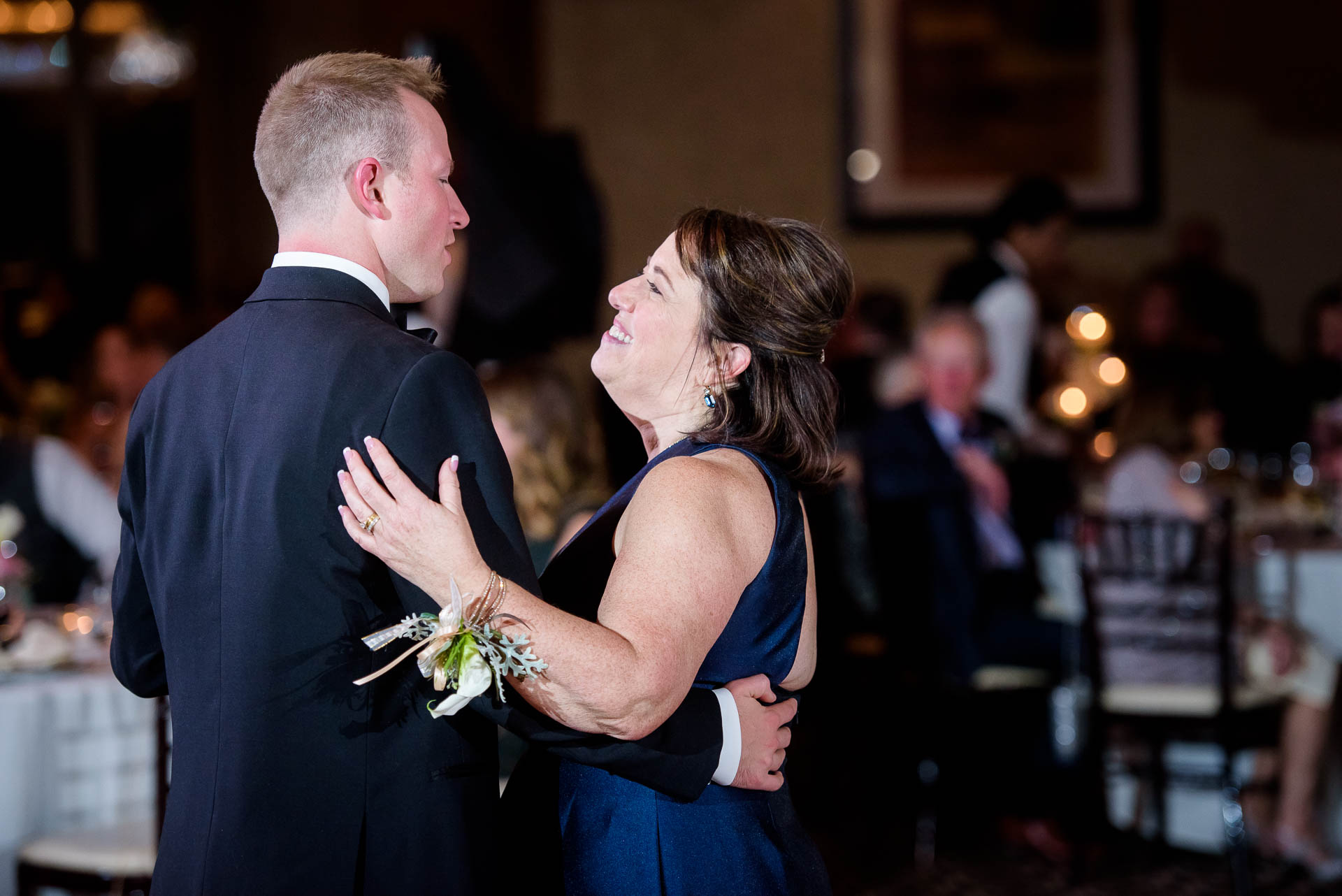 Mother and groom dance during their wedding reception at the Mid America Club in Chicago.