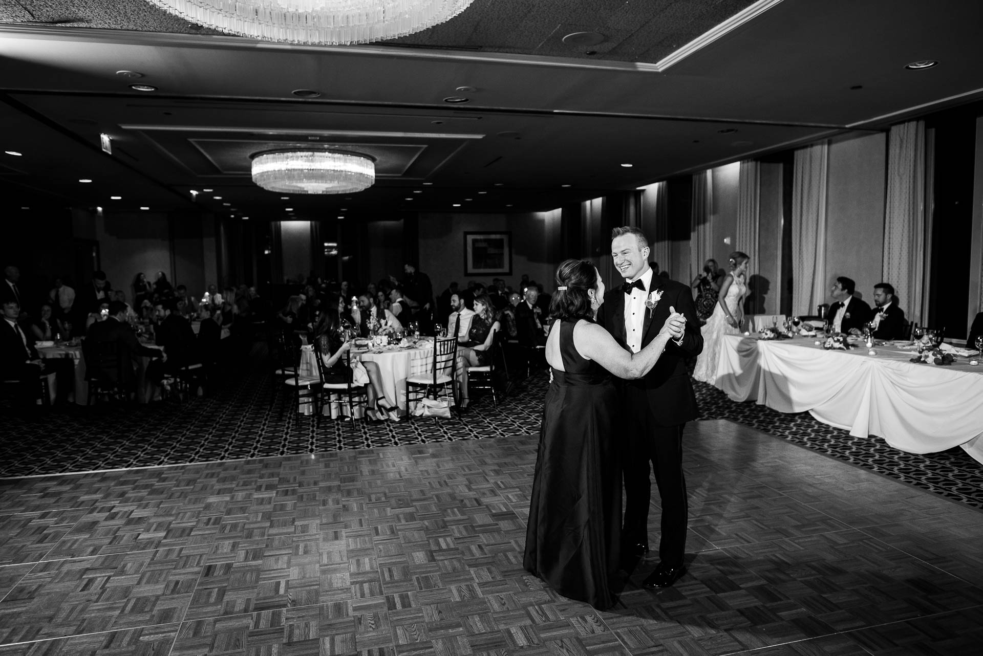 Mother and groom dance during their wedding reception at the Mid America Club in Chicago.