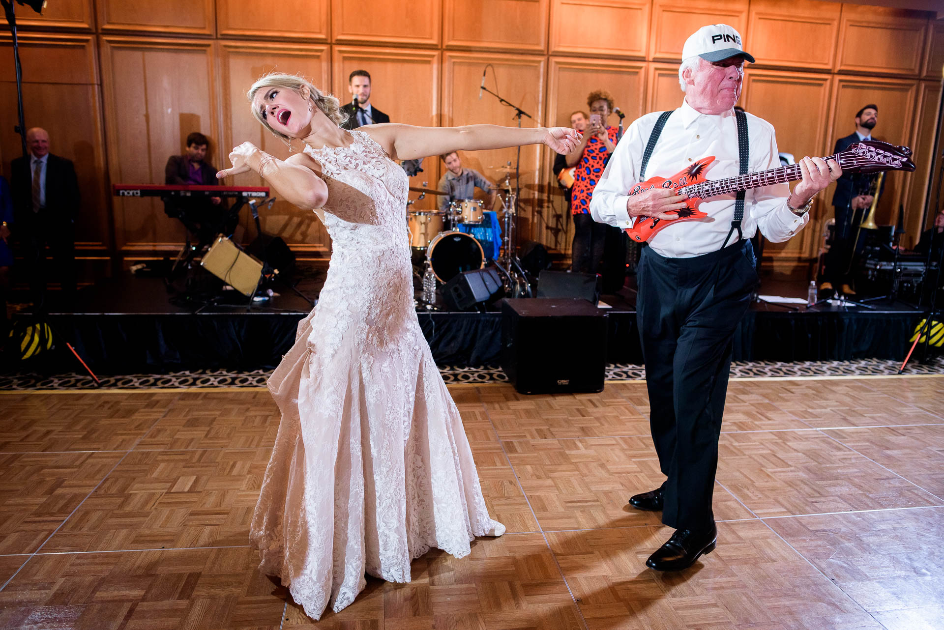 Bride and uncle dance during a wedding reception at the Mid America Club in Chicago.