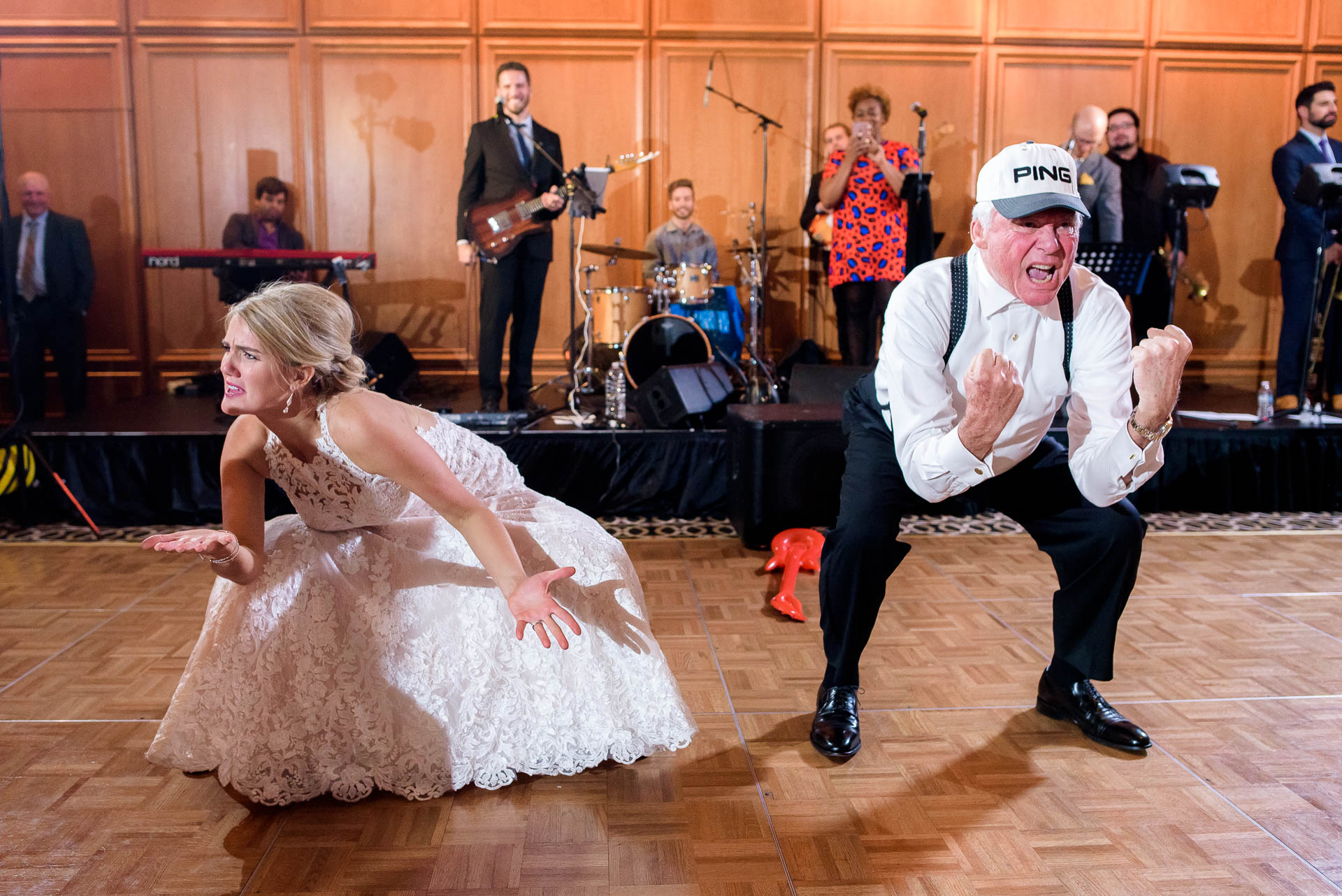 Bride and uncle dance during a wedding reception at the Mid America Club in Chicago.