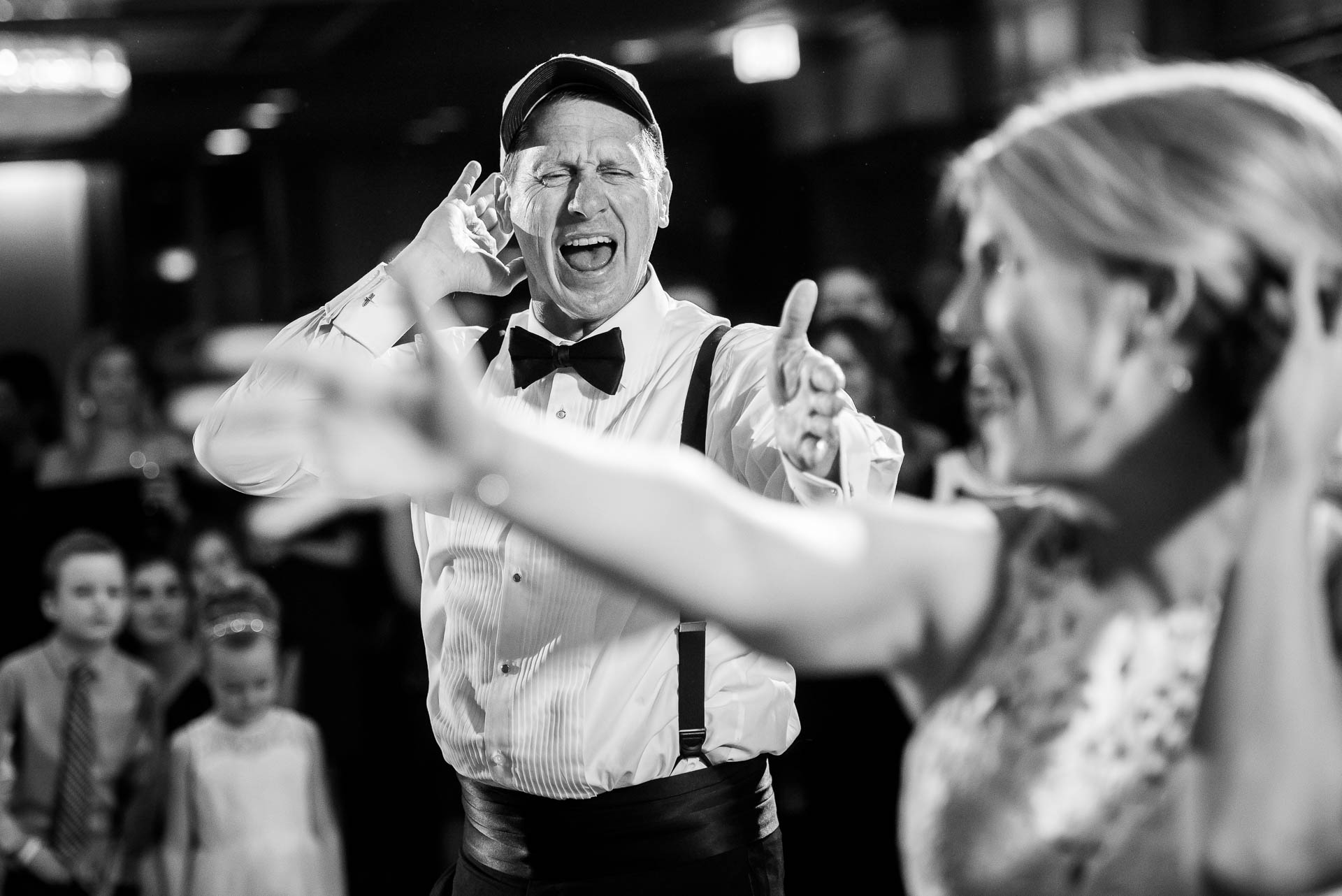Bride and uncle dance during a wedding reception at the Mid America Club in Chicago.