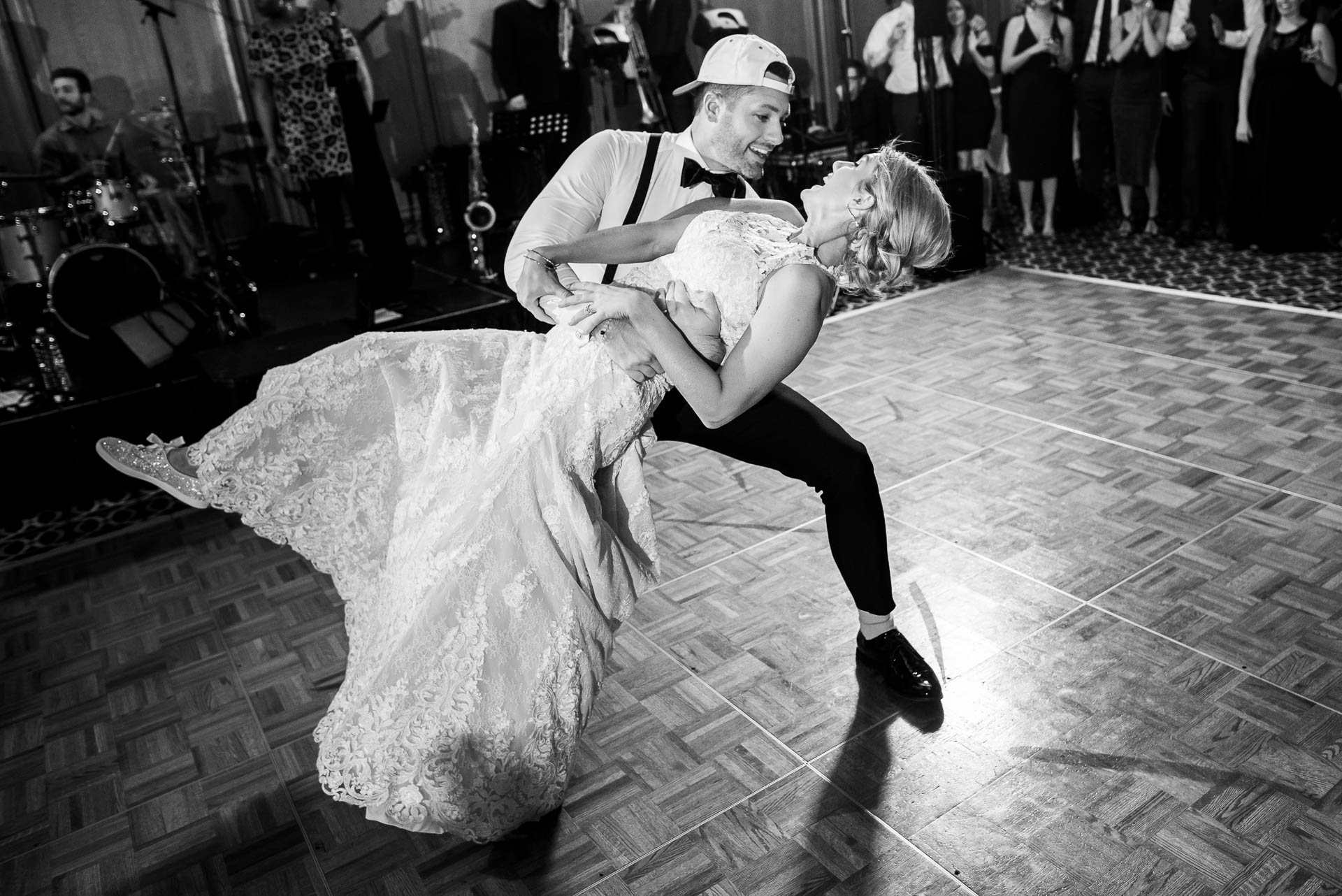 Bride and brother dance during a wedding reception at the Mid America Club in Chicago.